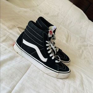 Black and white high top vans